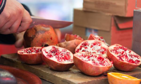 cutting a pomegranate