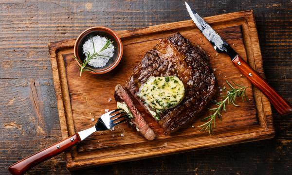 grilled ribeye steak with herb butter